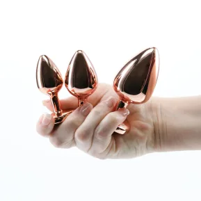 На фото набор анальных пробок NS Novelties Rear Assets - Trainer Kit - Rose Gold - Pink Heart