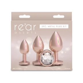 На фото набор анальных пробок NS Novelties Rear Assets - Trainer Kit - Iridescent Champagne - Clear Gem