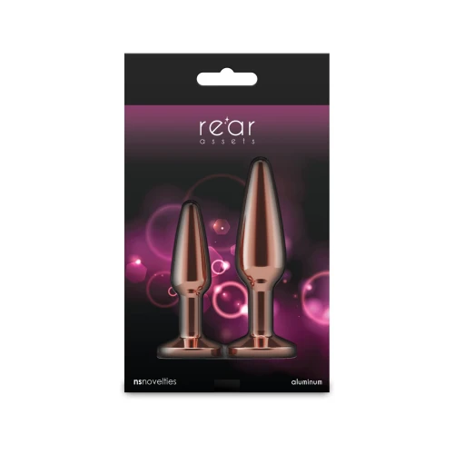 На фото набір анальних пробок NS Novelties Rear Assets - Tapered Trainer Kit - Rose Gold - Pink