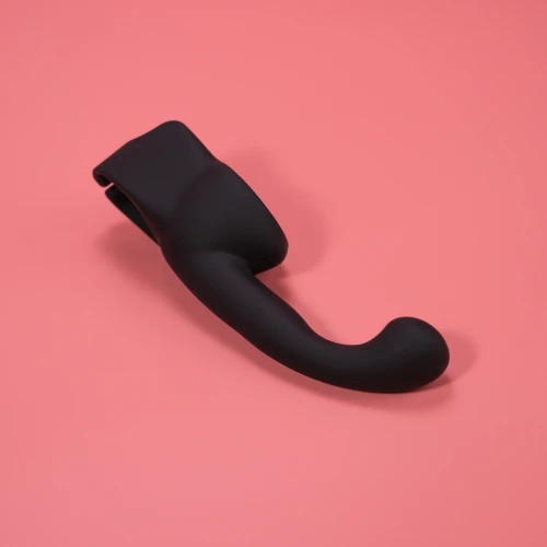 На фото изображена черная насадка Lovense Domi Male Attachment для вибраторов Domi и Domi 2 для мужчин на розовом фоне.