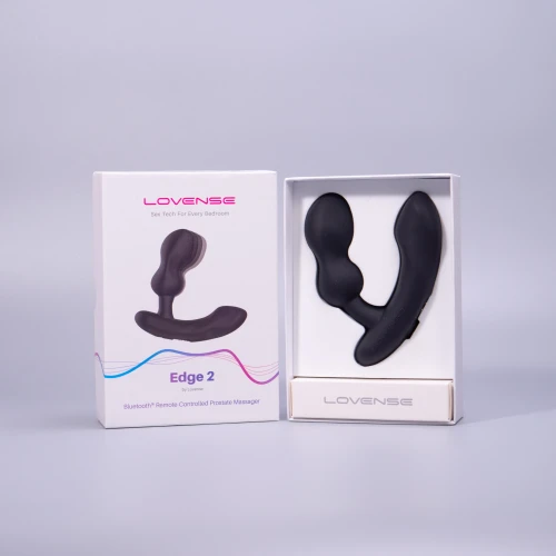 На фото изображен черный вибромассажер простаты с функцией Смарт для мужчин на светлом фоне