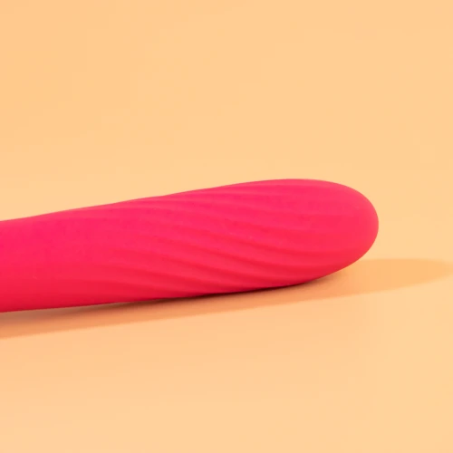 на фото изображен вибратор розового цвета его основная часть