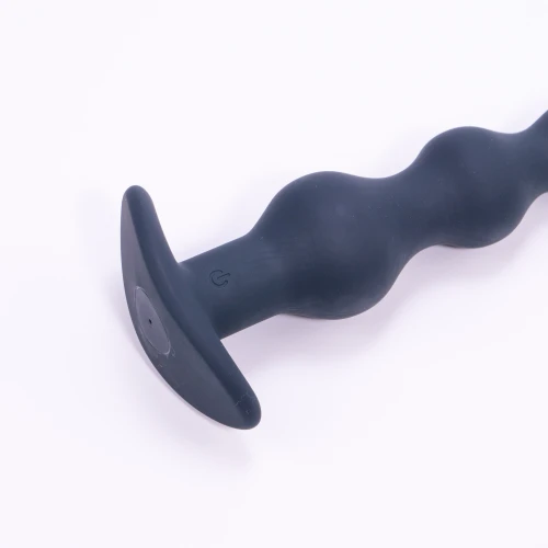 На фото изображена черная анальная вибропробка Dorcel DEEP SECRET M на светлом фоне