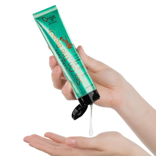 На фото изображен зеленый лубрикант на водной основе cо вкусом коктейля секс на пляже Orgie Lube Tube Sex On The Beach, 100 мл унисекс на белом фоне.