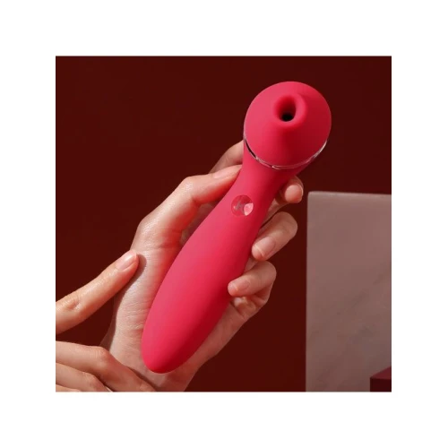 На фото изображен красный вакуумный вибратор KisToy Polly Plus Red для женщин на красном фоне.