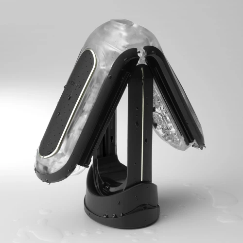 На фото зображено чорний Tenga Flip Zero Electronic Vibration Black - Мастурбатор із двома вібруючими ядрами для чоловіків на світлому тлі