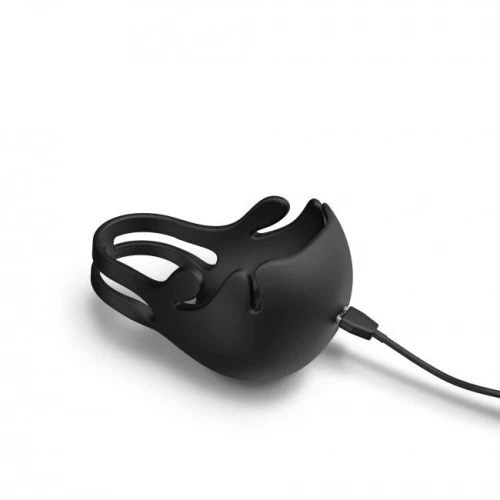 На фото зображено чорне кільце для члена з вібрацією та стимуляцією мошонки Dorcel FUN BAG для чоловіків на світлому фоні