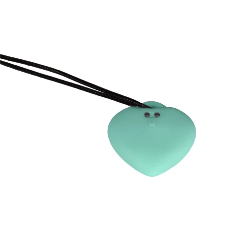 На фото зображено зелений вібратор серця із чорним ланцюжком FairyGasm PleasureStone green для жінок на білому тлі.