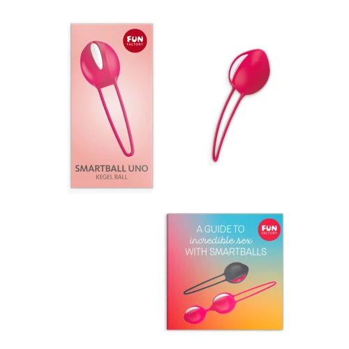 На фото зображено рожеву вагінальну кульку з білою вставкою SMARTBALL UNO для жінок на білому тлі.