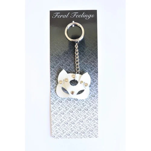 На фото изображен белый брелок-кошечка для ключей унисекс на светлом фоне