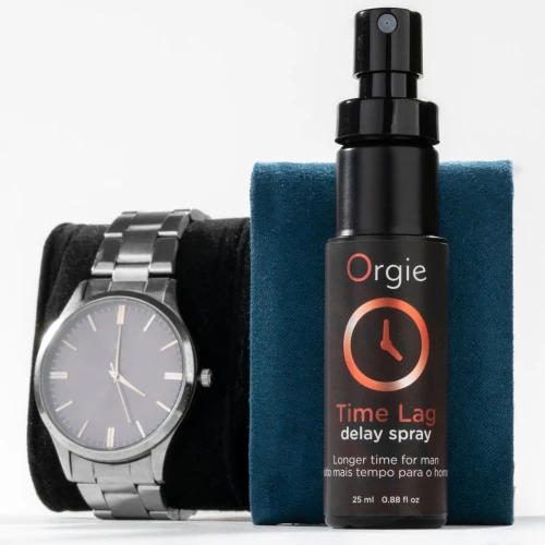 На фото изображен черный спрей-пролонгатор Orgie Time Lag Delay Spray, 25 мл, без анестетиков, с пантенолом для мужчин на белом фоне