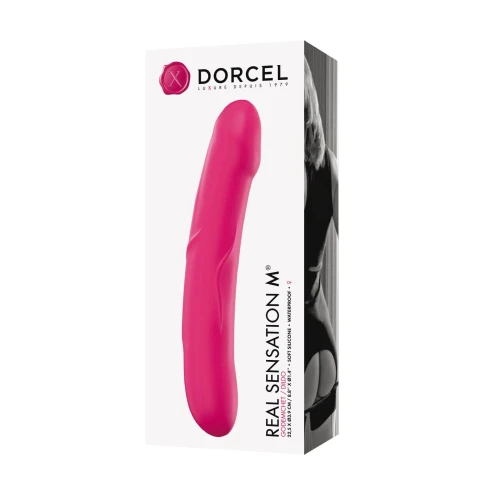 На фото изображен розовый красивый дилдо с небольшим рельефом Dorcel Real Sensation M Magenta унисекс на белом фоне.
