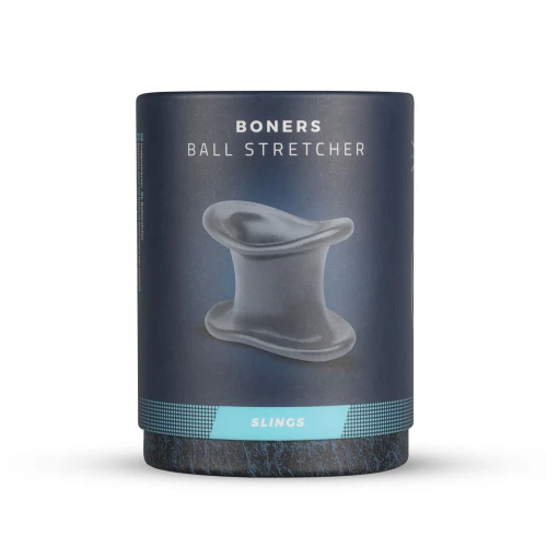 На фото изображено серое эрекционное кольцо Boners Ball Stretcher в серой коробке для мужчин на белом фоне