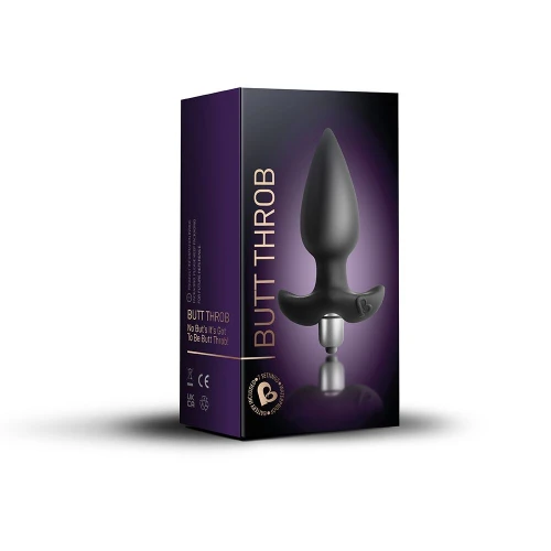 На фото зображено чорний анальний стимулятор Rocks Off Butt Throb Black у чорній коробці унісекс на світлому фоні