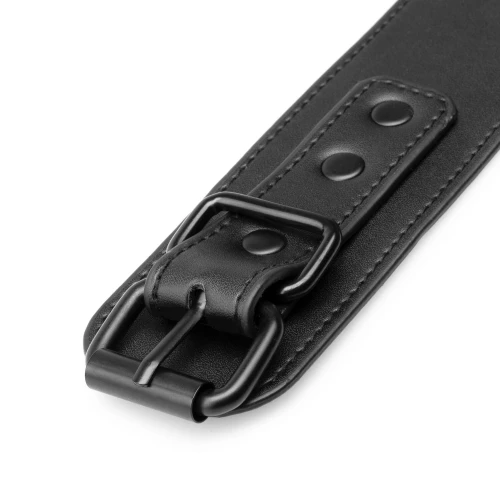 На фото зображені чорні наручники для постільної білизни Bedroom Fantasies Handcuffs унісекс на білому тлі