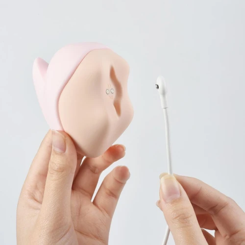 На фото зображено рожевий стимулятор із вакуумом та вібрацією у формі єдинорога Magic Motion Unicorn Pink для жінок на білому тлі.