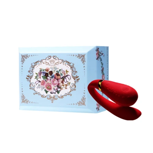 На фото изображен красный вибратор Zalo - Fanfan Bright Red для пар на белом фоне.