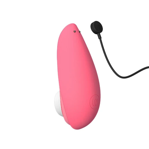 На фото изображен розовый вакуумный стимулятор Womanizer Liberty 2 Rose для женщин на белом фоне.