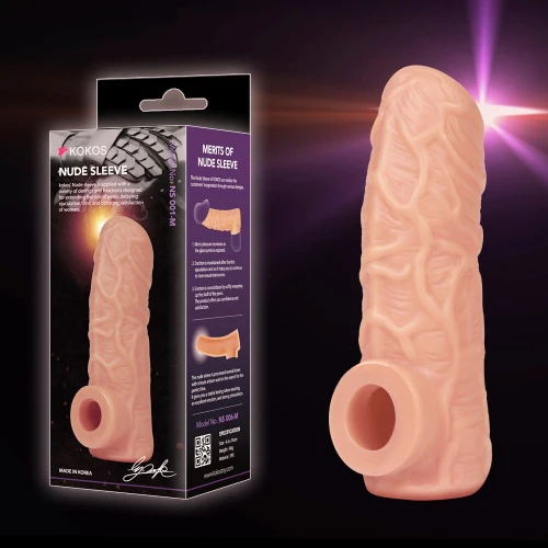 На фото изображена бежевая сквозная насадка на член Kokos Nude Sleeve NS 001 М для пар на черном фоне.