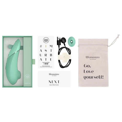 На фото изображен зеленый вакуумный стимулятор Womanizer Next Sage для женщин на белом фоне.