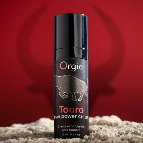 На фото изображен черный Крем для усиления эрекции Orgie Touro Power Cream, 15 мл, с таурином, гинкго и корнем женьшеня для мужчин на красном фоне