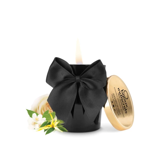На фото зображено свічку для масажу з чорним бантом Bijoux Indiscrets Aphrodisia Scented Massage Candle для пар на білому тлі.