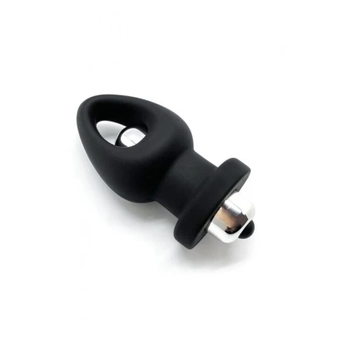 На фото изображена черная анальная пробка с вибрацией Wooomy Orny унисекс на белом фоне