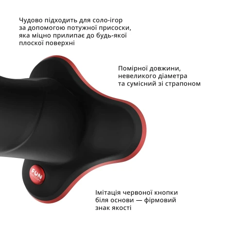 На фото изображен черный массивный фаллоимитатор с присоской Fun Factory THE BOSS STUB унисекс на белом фоне.