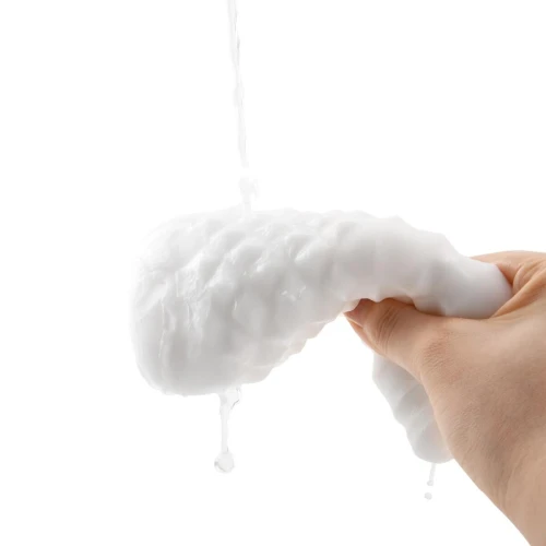 На фото зображено білий Otouch DECOR 1-В - Недорогий ручний мастурбатор на світлому фоні.