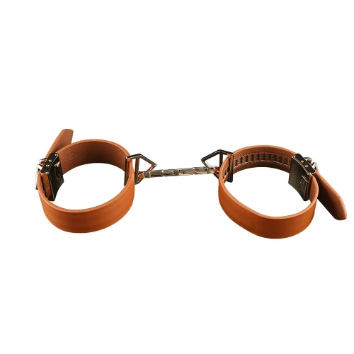 На фото изображены коричневые наручники LOCKINK Wristcuffs/Anklecuffs Brown Set на белом фоне 