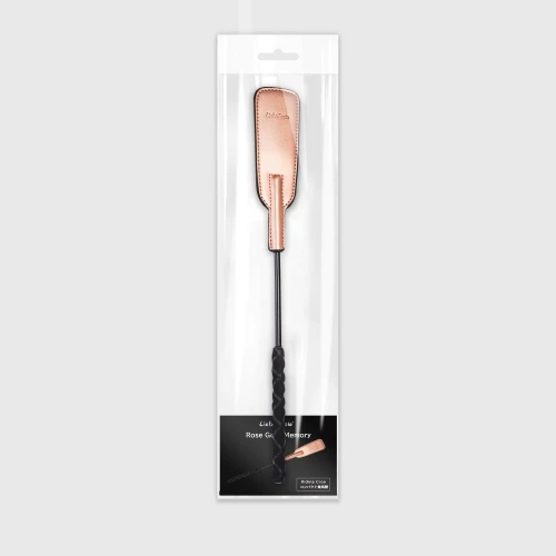 На фото изображена черно-розовая шлепалка Liebe Seele Rose Gold Memory Riding Crop унисекс на белом фоне