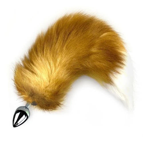 На фото зображена анальна пробка з помаранчевим хвостом лисиці Foxy fox унісекс на світлому фоні