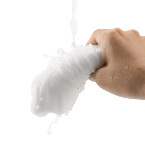 На фото изображен белый Otouch DECOR 1-D - Недорогой ручной мастурбатор на светлом фоне