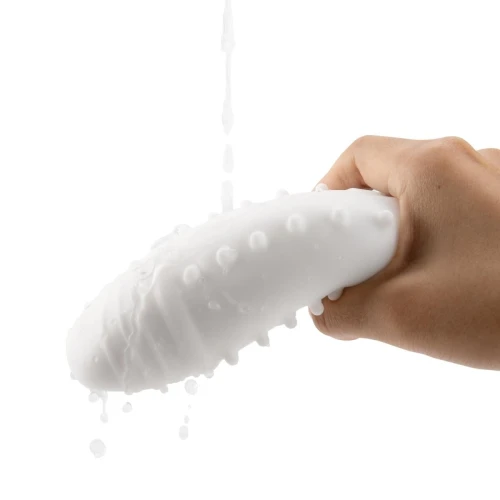 На фото зображено білий Otouch DECOR 1-E - Недорогий ручний мастурбатор на світлому фоні.