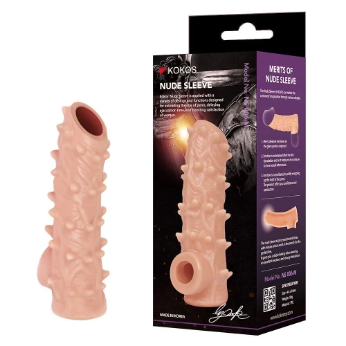 На фото изображена бежевая сквозная насадка на член Kokos Nude Sleeve NS 006 L для пар на белом фоне.