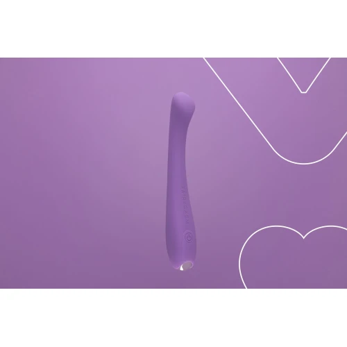 На фото зображено фіолетовий вібратор точки G FairyGasm MerryWand violet для жінок на фіолетовому  фоні.