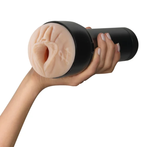 На фото зображено чорно-бежевий мастурбатор-вагіна Лі Рейвен Kiiroo Feel Kiiroo Feel для чоловіків на білому тлі