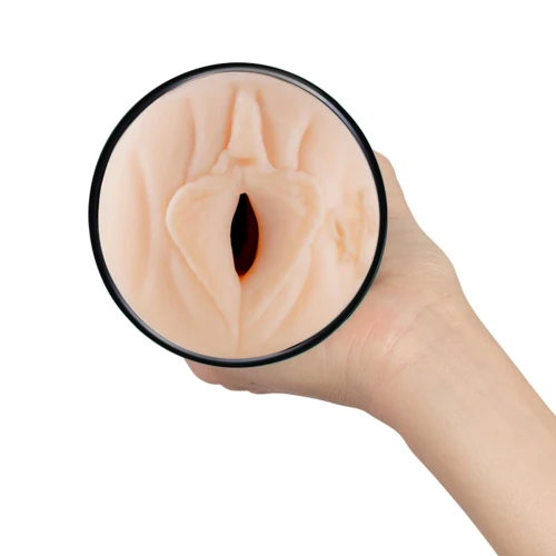 На фото зображено чорно-бежевий мастурбатор-вагіна Лі Рейвен Kiiroo Feel Kiiroo Feel для чоловіків на білому тлі