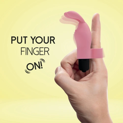 На фото изображен розовый вибратор на палец с ушками FeelzToys Magic Finger Vibrator Pink для пар на желтом фоне