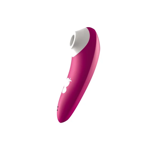 На фото изображен розовый вакуумный стимулятор Romp Shine для женщин на белом фоне.