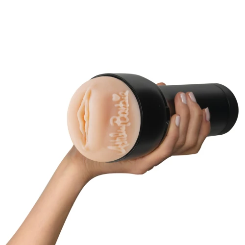 На фото зображено чорно-бежевий мастурбатор-вагіна Ешлі Барбі Kiiroo Feel Ashley Barbie для чоловіків на білому тлі.