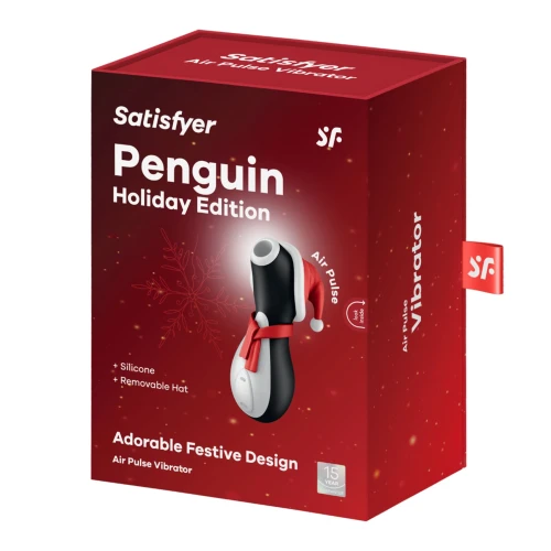 На фото зображено чорно-білий вакуумний вібратор Пінгівін Satisfyer Penguin Holiday Edition у червоному шарфі та червоній шапочці для жінок на білому тлі.