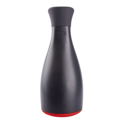 На фото изображен черно-красный мастурбатор  с вибрацией и регулировкой давления Otouch NINJA 2  для мужчин на светлом фоне