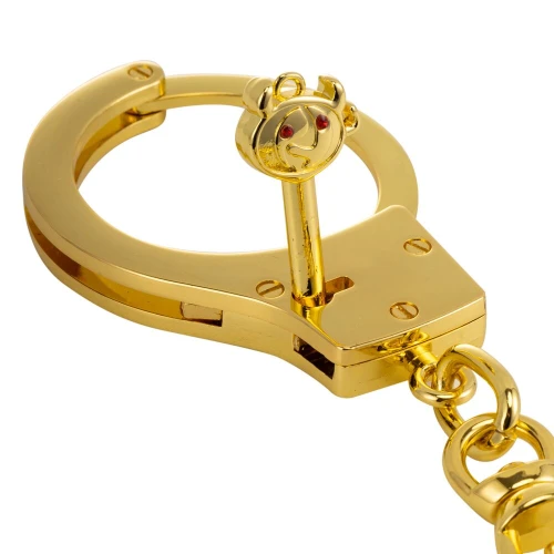 На фото изображены золотые наручники LOCKINK Pretty-sub Handcuffs на белом фоне 