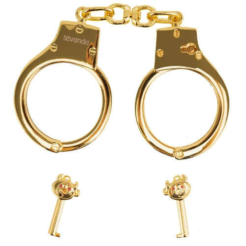 На фото изображены золотые наручники LOCKINK Pretty-sub Handcuffs на белом фоне 