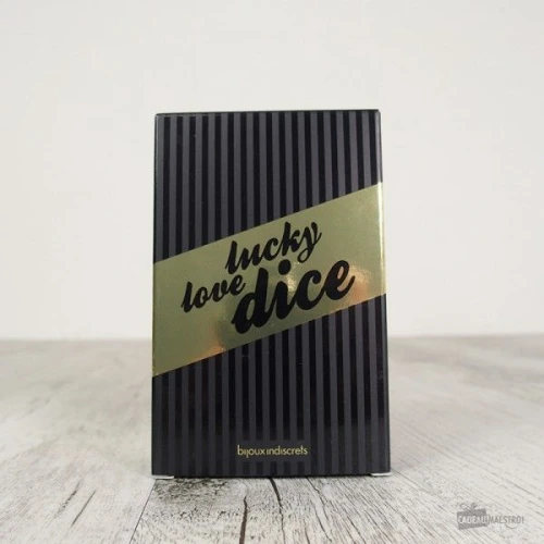 На фото изображены черные игральные кубики Bijoux Indiscrets Lucky Love Dice для пар на светлом фоне.