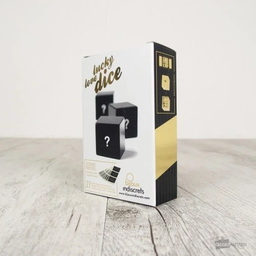 На фото изображены черные игральные кубики Bijoux Indiscrets Lucky Love Dice для пар на светлом фоне.