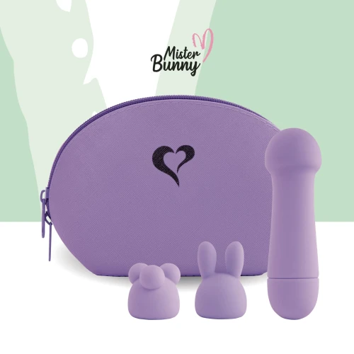 На фото зображено фіолетовий віброкуль FeelzToys Mister Bunny Purple для жінок на зеленому тлі.