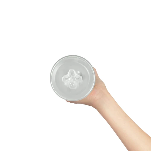 На фото изображен прозрачный мастурбатор Kiiroo Feel Pocket Crystal для мужчин на светлом фоне