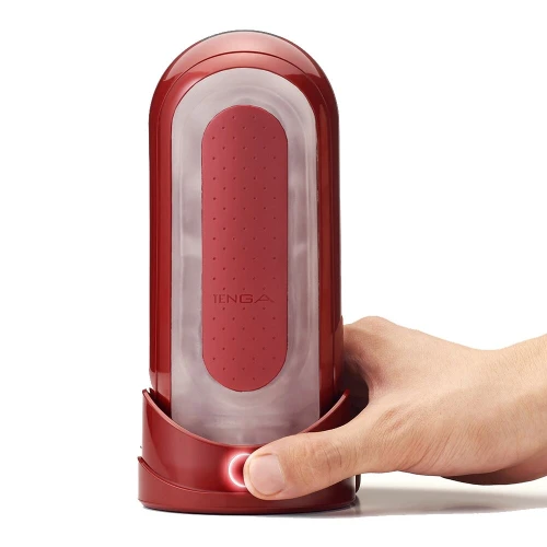 На фото зображено червоний мастурбатор із нагрівачем Tenga Flip Zero Red + Flip Warming Set для чоловіків на світлому фоні